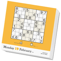 a yellow and white box with a sudoku puzzle on it